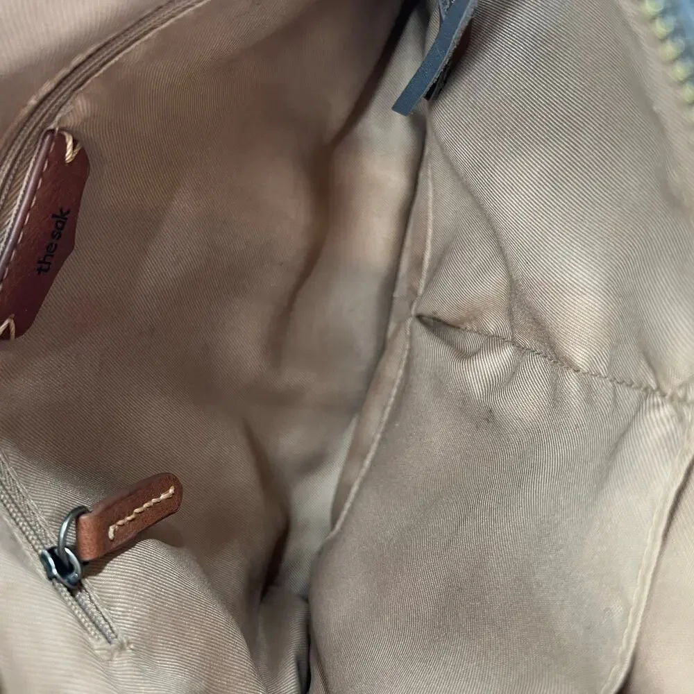 The Sak top zip crossbody bag back zip neutral colors every day travel bag